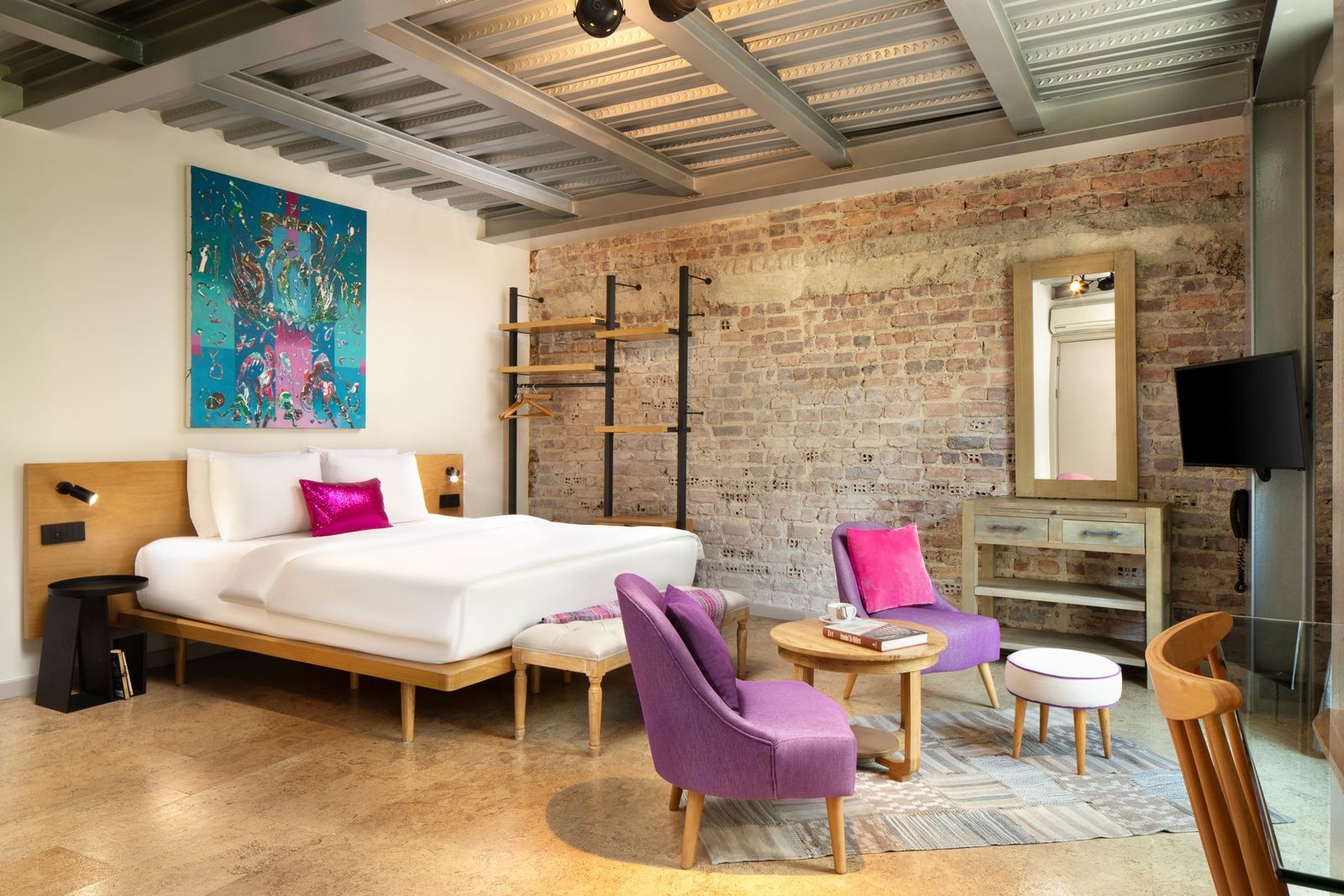 A close detail of the Studio Flat's exposed brick wall, lime mortar visible between the warm Ottoman bricks.